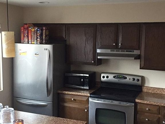 updated kitchen with stainless steel appliances and new ligh