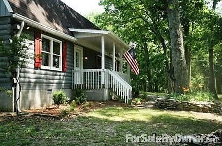 front porch faces west, towards sunsets, with porch swing