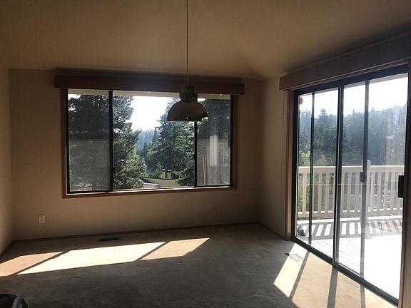 Dining area next to sliding door to deck