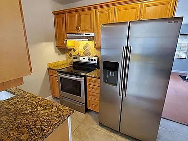 Newly added stainless steel appliances, range, dishwasher, fridge/freezer.