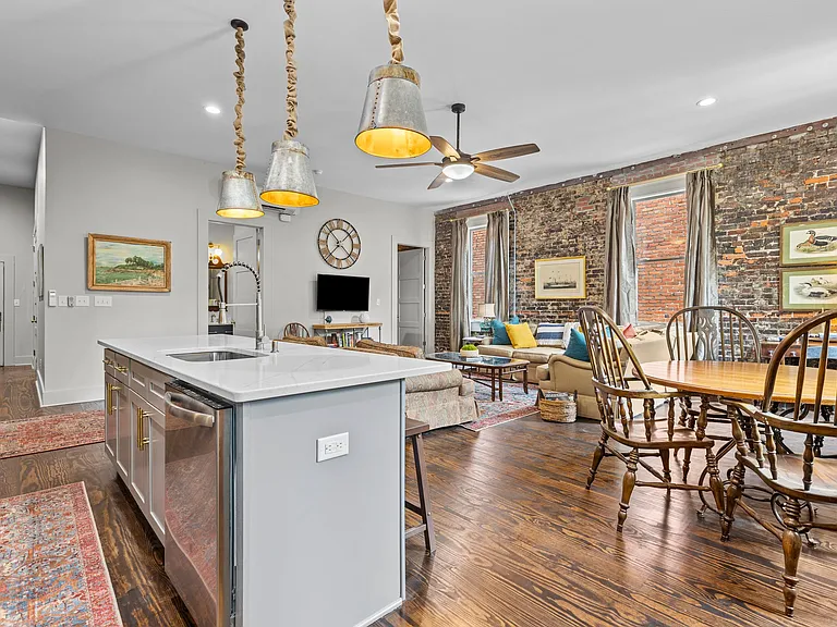Exposed brick and unique touches throughout the apartment offering a cozy and inviting feel to this space.