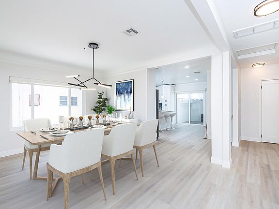 Living and Dining are open concept with immediate access to kitchen and sliding glass door to outdoor living space.