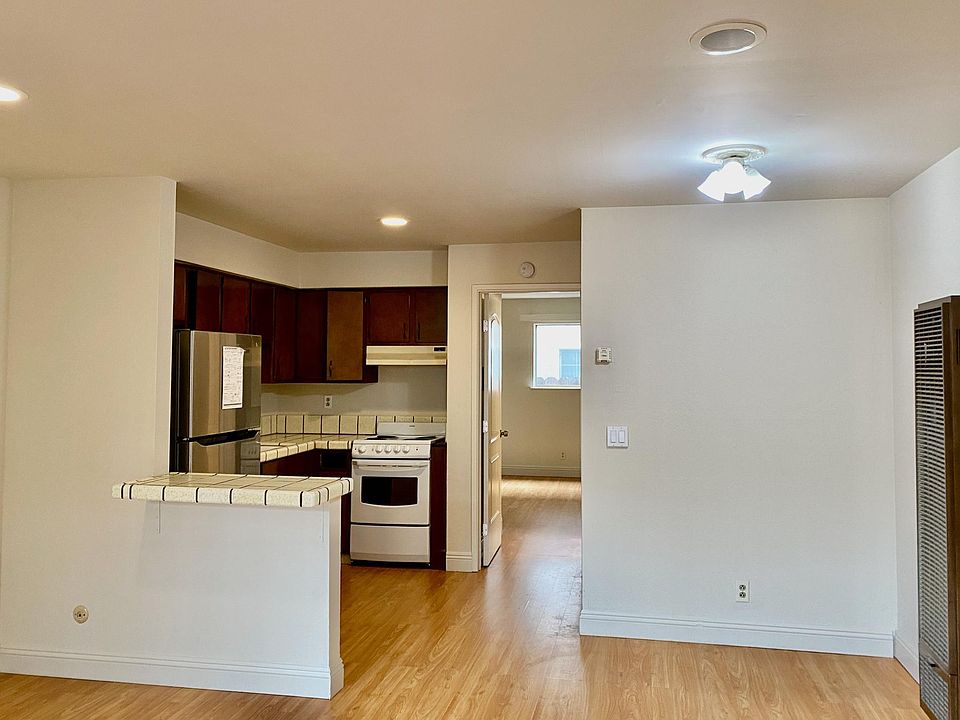 Adjacent to the kitchen is an area for an eating table (note the kitchen cabinets are currently white. See previous photo)