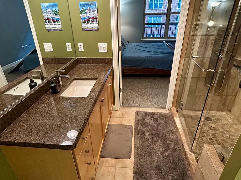 Luxury bathroom with stone steam shower and tons of countertop space with storage underneath.