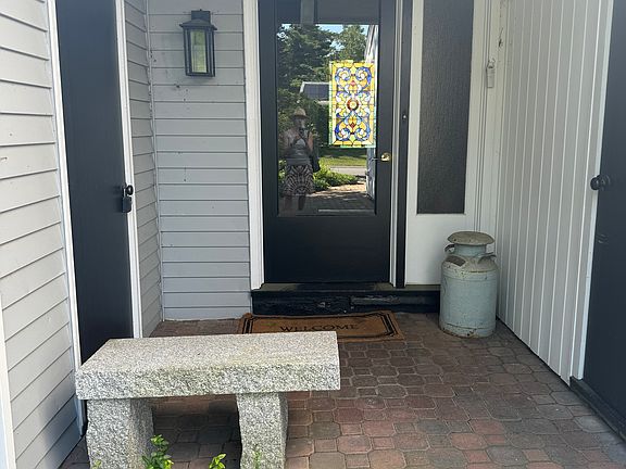 Side entryway opens to foyer, laundry, fireplaced family room and updated kitchen