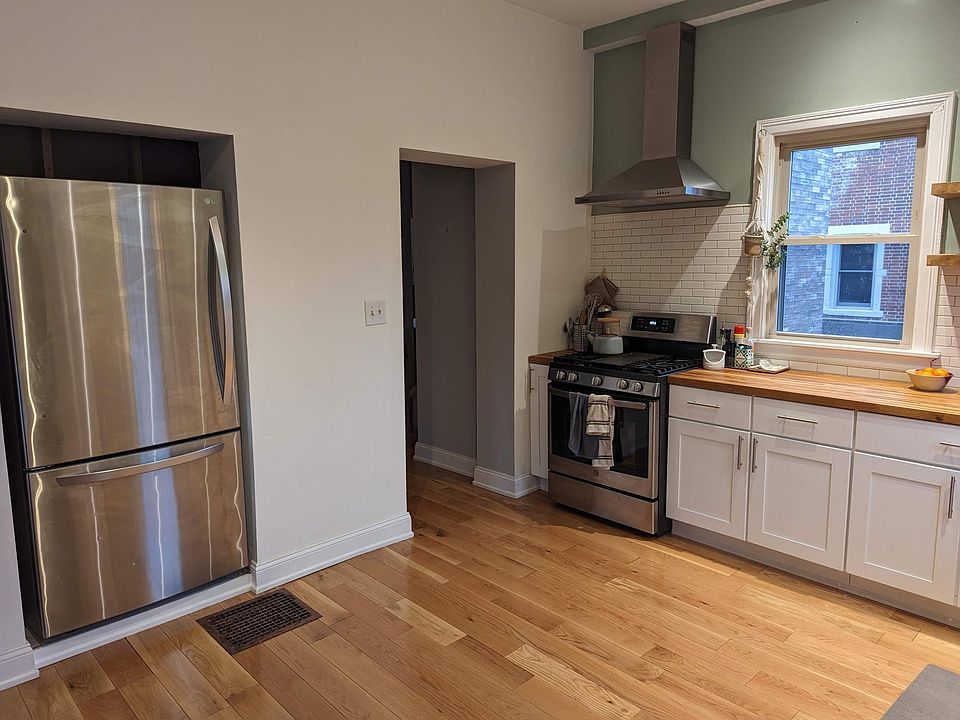 Newly renovated kitchen. Hardwood floor, custom shelves, new appliances, butcherblock countertop.