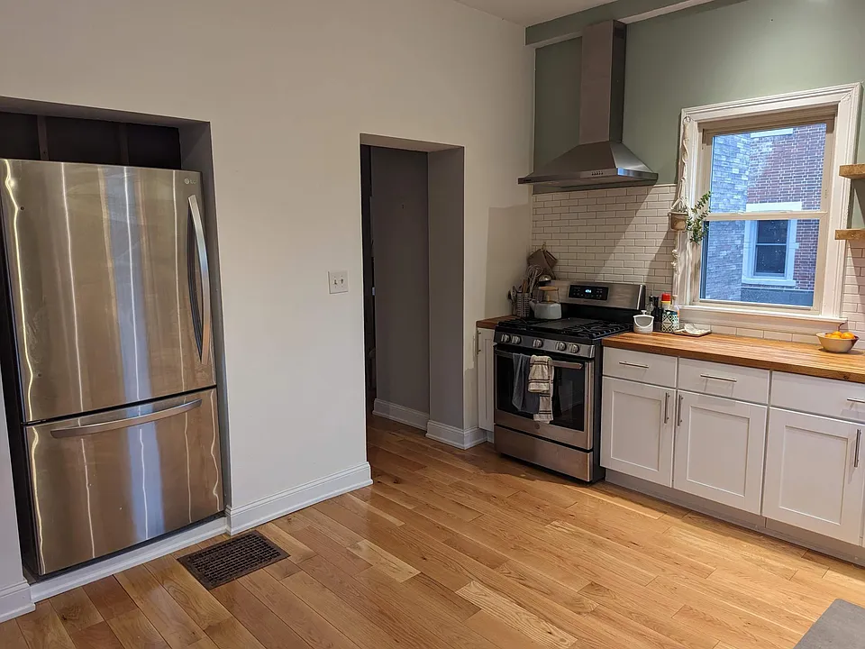 Newly renovated kitchen. Hardwood floor, custom shelves, new appliances, butcherblock countertop.