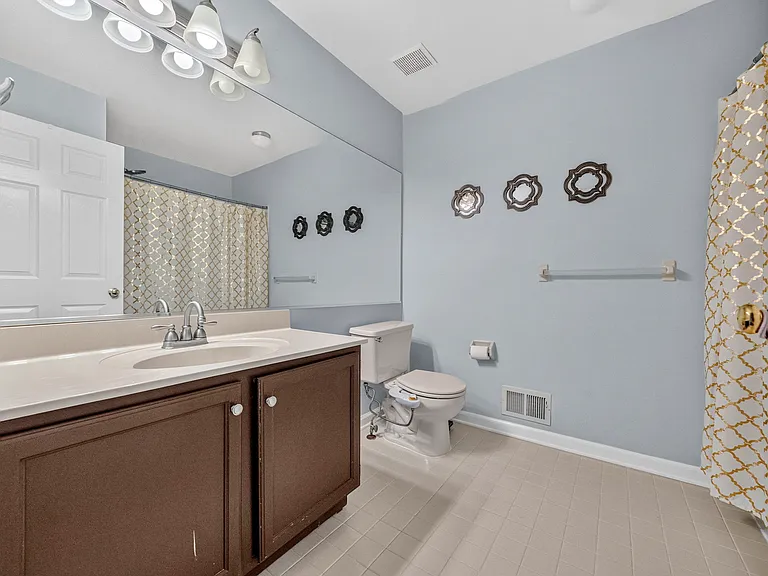 Full Bathroom featuring spacious vanity tub/shower combo.