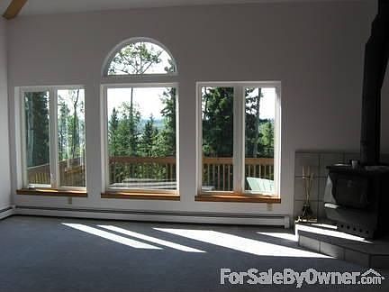 living room
						:
						windows give one a view of the AK range as well as the Tanana river