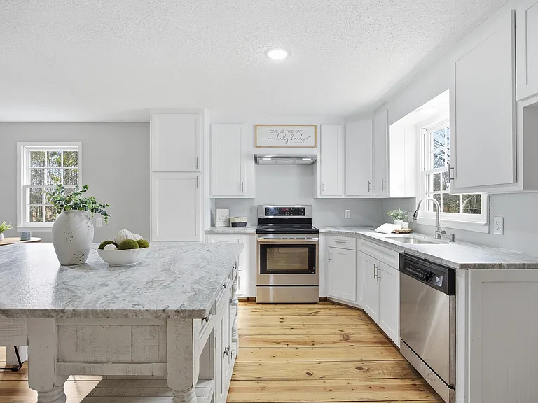 Kitchen view showing range oven and dishwasher