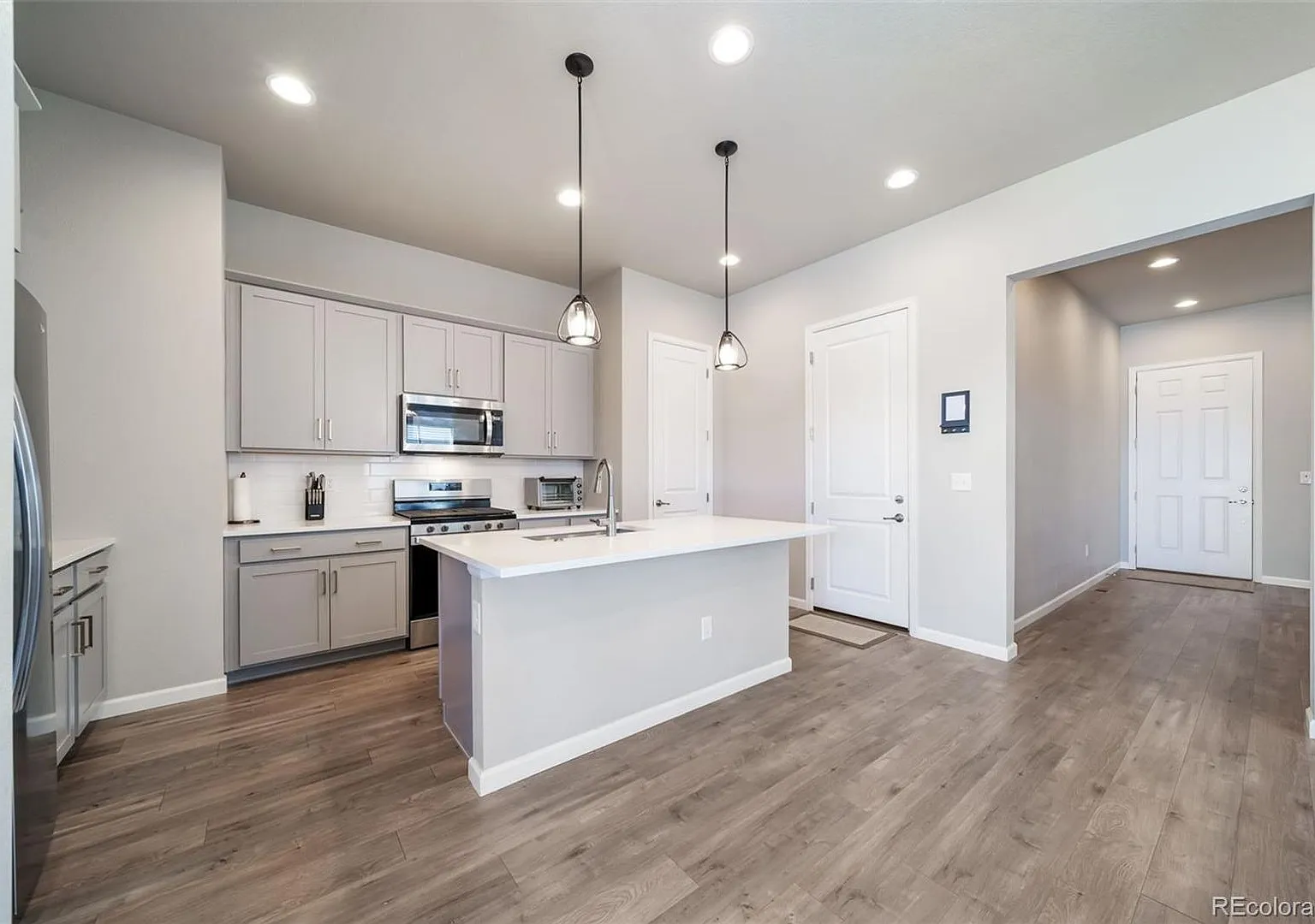 New ranch style home with a finished basement, spacious primary suite, open kitchen, & profession... — Photo 4