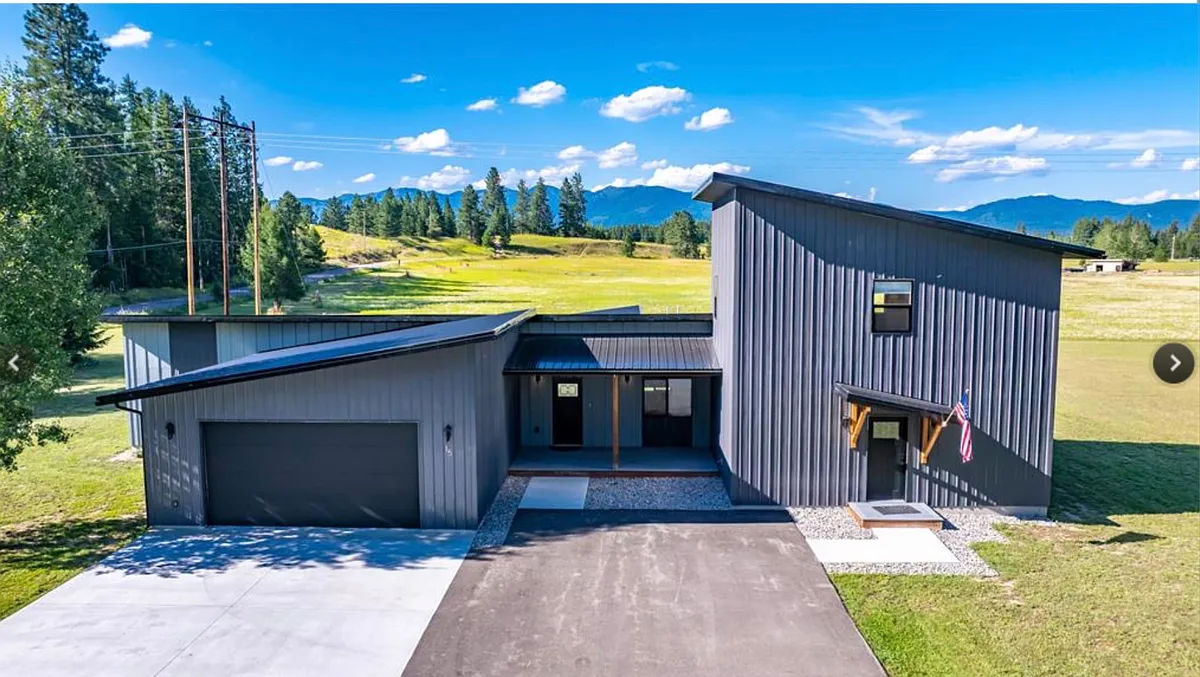 Spacious oversized 2-car garage and extended driveway designed to accommodate multiple vehicles, ski gear, and an active Montana lifestyle. - 15 Sandy Hill Ter