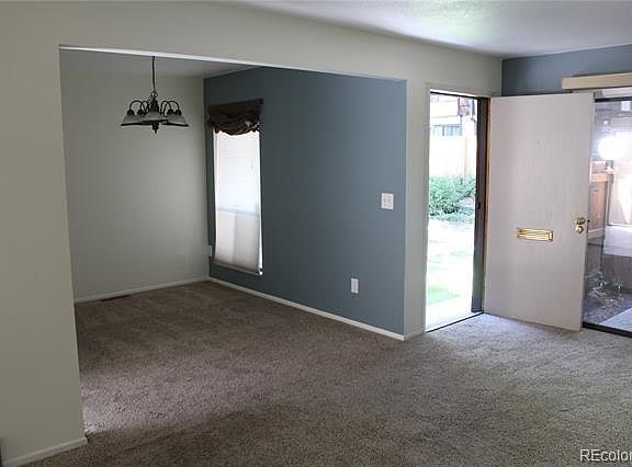 Living room, dining area, front door, front patio door