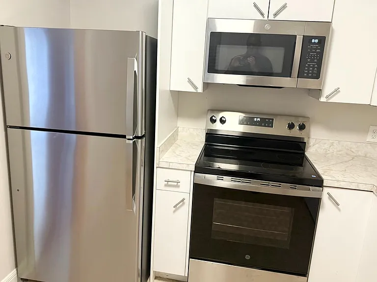 Kitchen has new cabinetry and granite countertops since photo was taken.