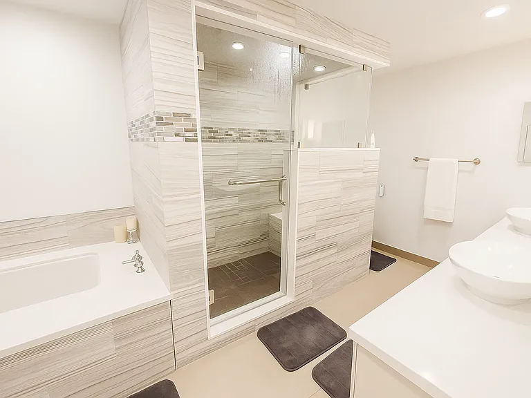 Custom designed primary bathroom with jacuzzi tub, steam shower with built in bluetooth sound system and aromatherapy function