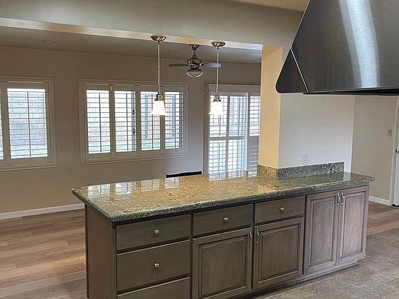 Island offers bar seating for quick meals.
