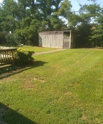 Back yard looking to carport off alley