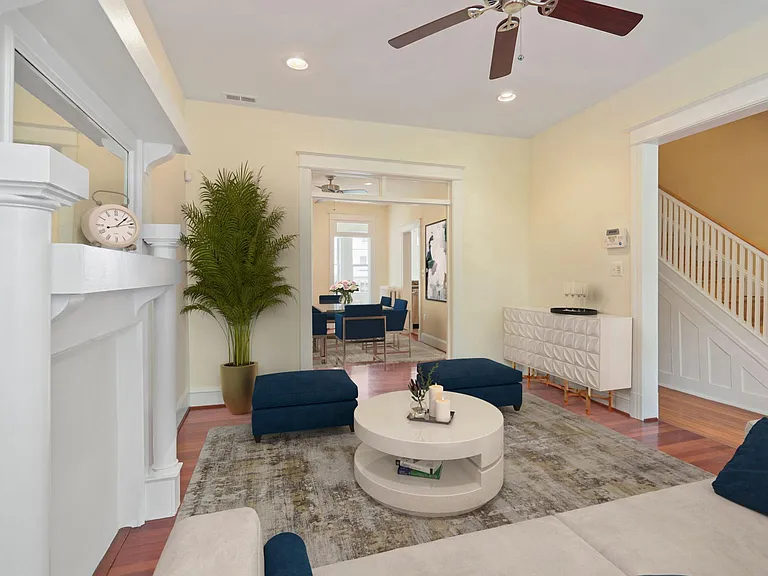 Living room with transomed archway to dining room