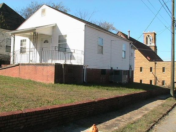 View of home from the corner of Mimosa Avenue & Atchley Avenue, with Church in background.