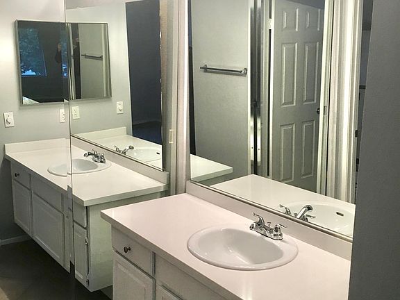 Master Bathroom, mirrored wardroom doors (one of two sets in the MB), new quartz countertop / sink / faucet.