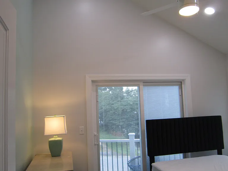 Bedroom (with cathedral ceiling and ceiling fan)