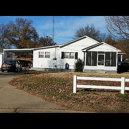 Side facing E. Commercial St