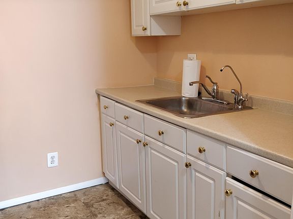 Cabinets, counter-top, & sink
