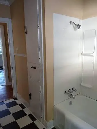 Full bath #1, tub/shower and cabinet