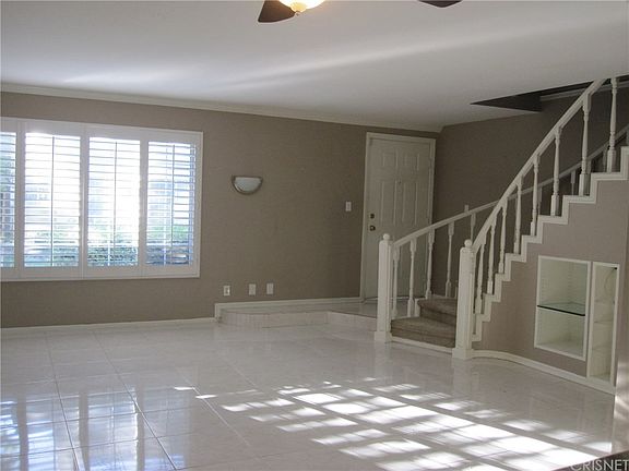 Huge living area with custom stair case, plantatio