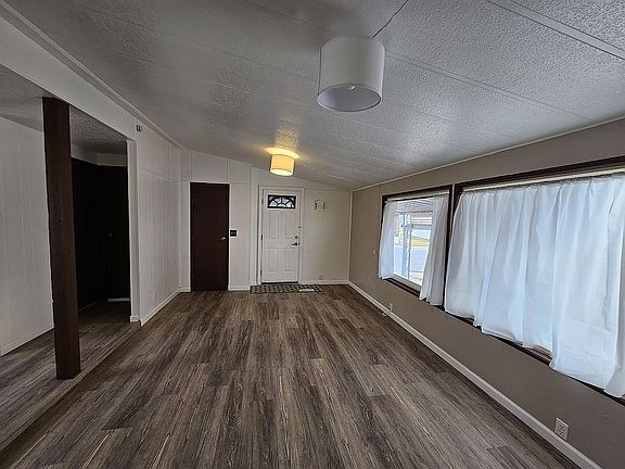 Living rm, toward the door