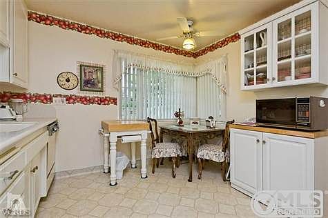 Upgraded kitchen w/corian counter tops, newer sink, upgraded cabinets, and fixtures.