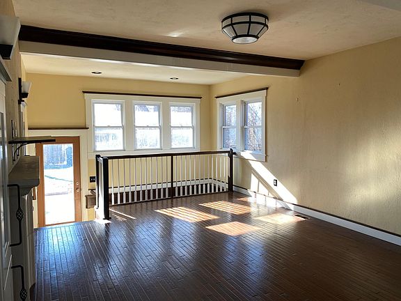 Living room main entrance with the fireplace and lots of natural light