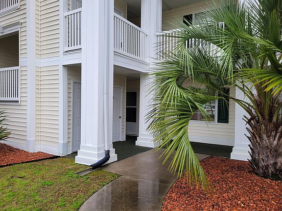 Front of Condo. Storage space is solid door to the left. Entrance door is the door with the screen.