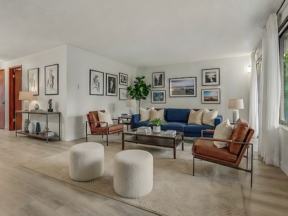 Virtual staging - upper apt has carpet and vaulted 10' ceilings