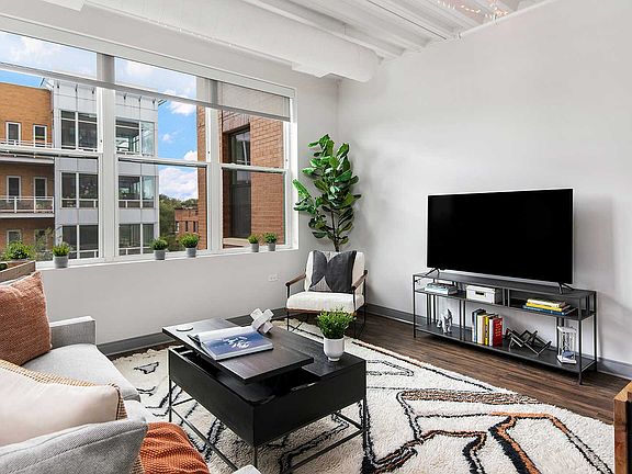 Our pet-friendly 1- and 2-bedroom industrial inspired lofts feature 9-foot, 4-inch ceilings with exposed structure and ductwork.