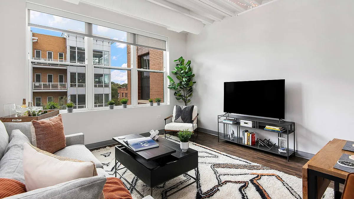 Our pet-friendly 1- and 2-bedroom industrial inspired lofts feature 9-foot, 4-inch ceilings with exposed structure and ductwork. - Wrigleyville Lofts