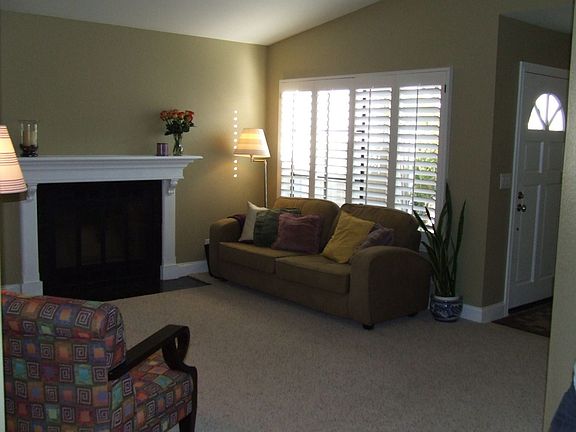 Living Room with custom Fireplace Mantle and Granite Hearth