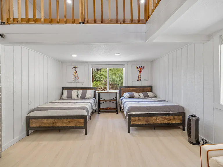 Third bedroom off Second can be closed off by sliding glass door. Additional sleeping loft is above. 2 full beds