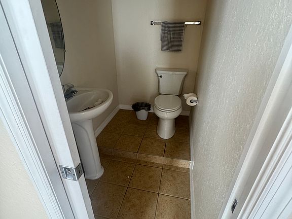 Half bath in kitchen/dining area.