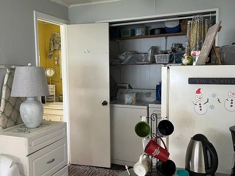 Half of 5th room opens to half bath and laundry closet