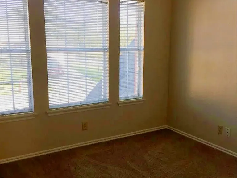 Third bedroom upstairs looking out over street.