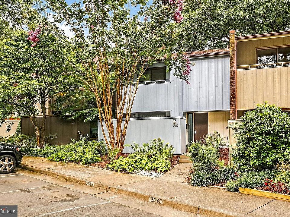 Front with 1 assigned parking and several available guest lots