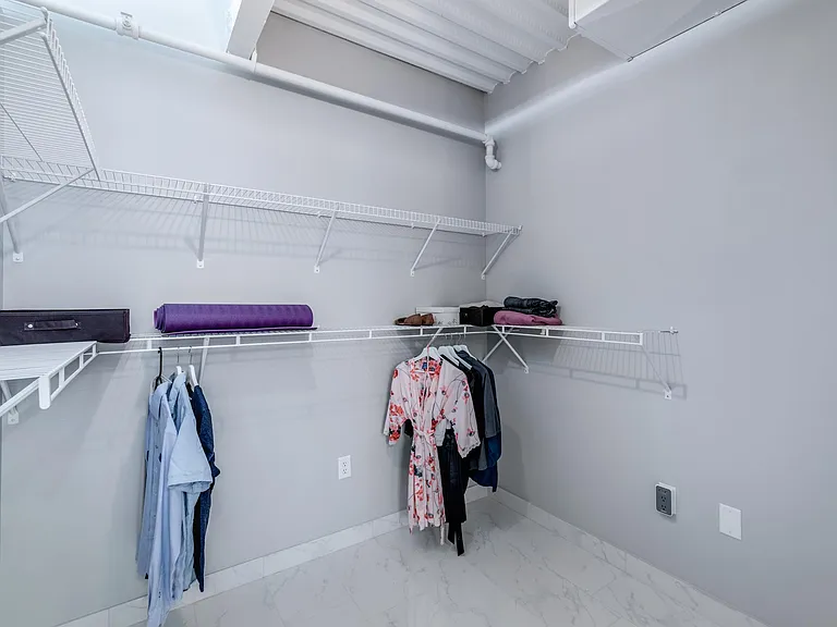 Walk-in closet with laundry.
