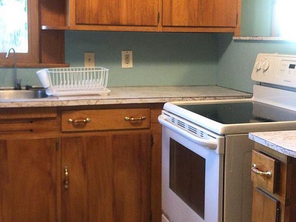 Glass-top stove and many cabinets