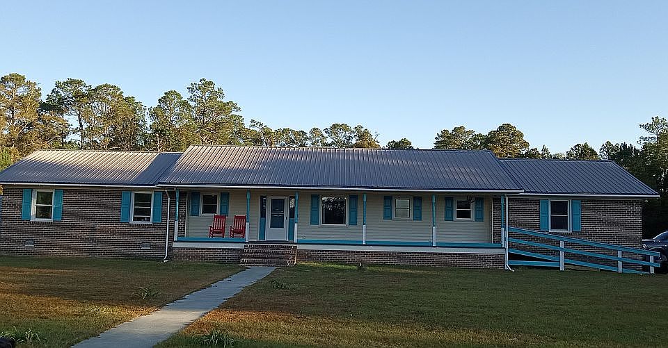 Home Front w/metal roofing.
