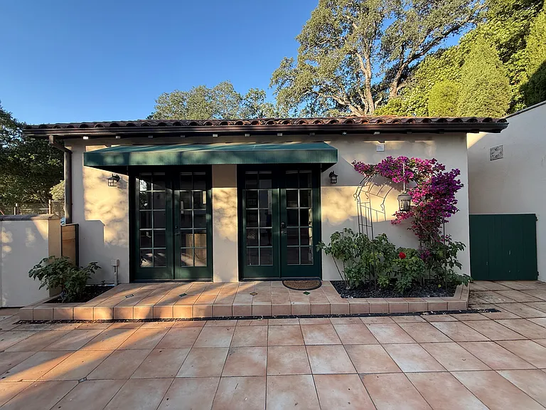 ADU has large french doors facing patio. Doors have shades to enable privacy for the ADU.