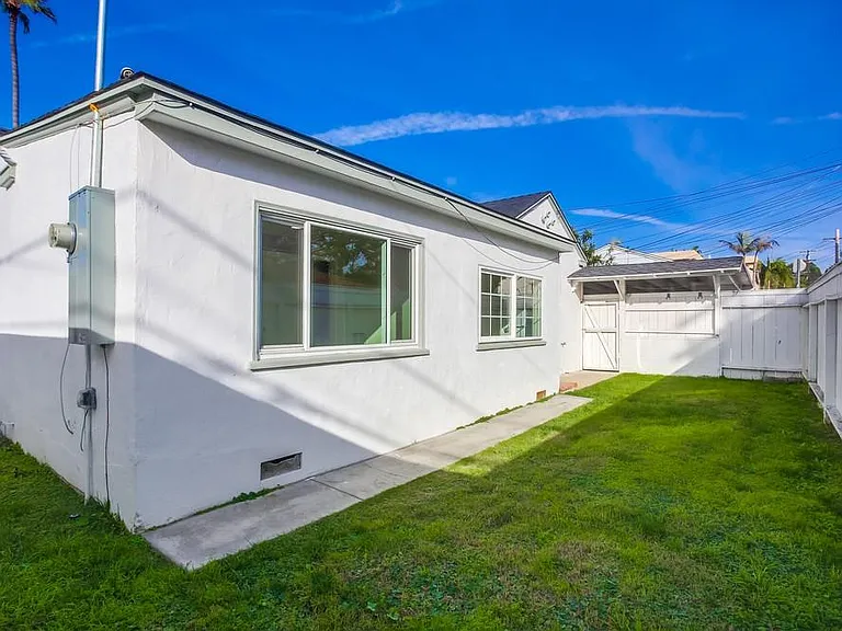 Large fenced grass area perfect for kids and dogs.