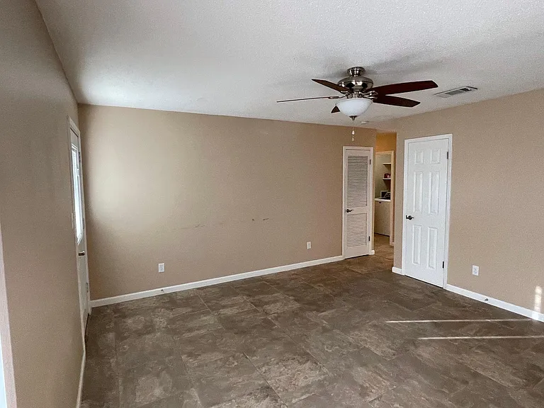 Living room view of hall and laundry room