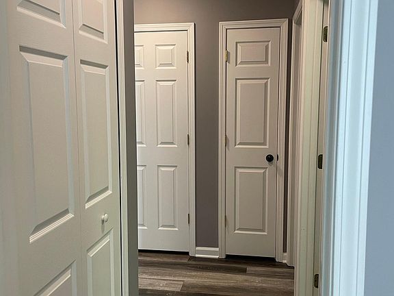Hall from 2nd BR w three storage closets