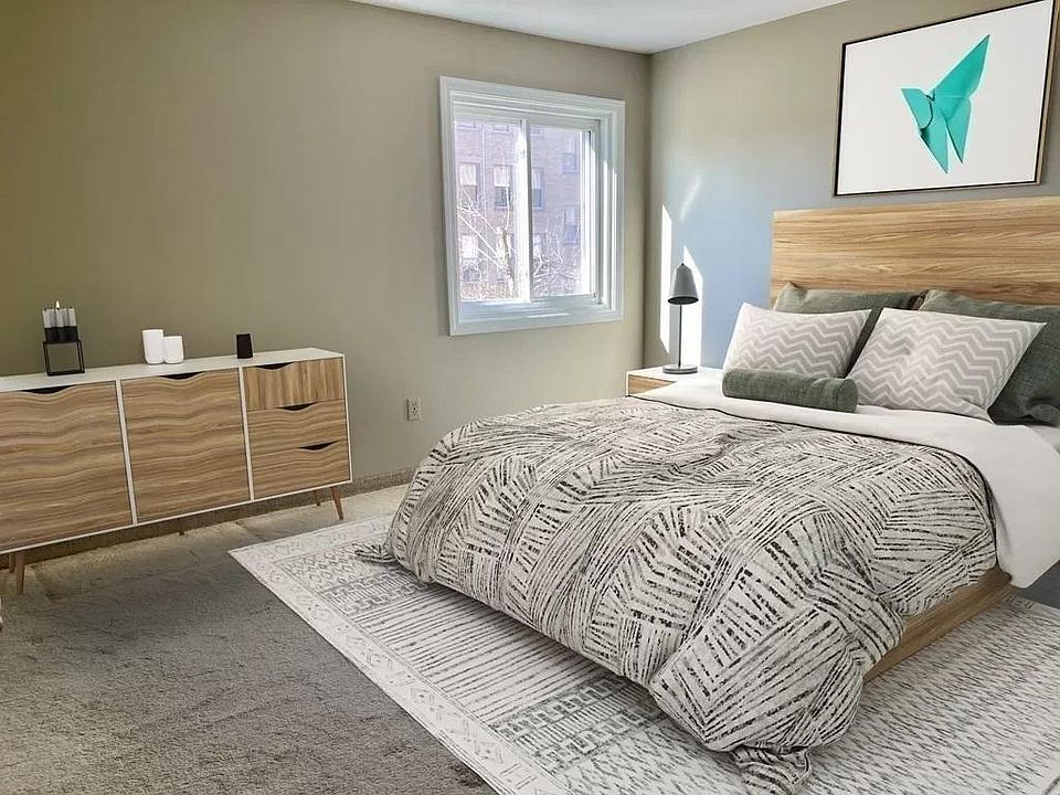 Bedroom with staged furniture for your reference.